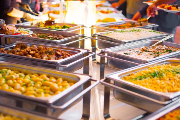 People group catering buffet food indoor in luxury restaurant with meat colorful fruits and vegetables.